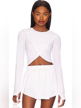 FP MOVEMENT by FREE PEOPLE WITH A TWIST LAYERING TOP